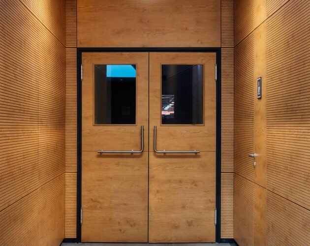wooden acoustic wall paneling and door